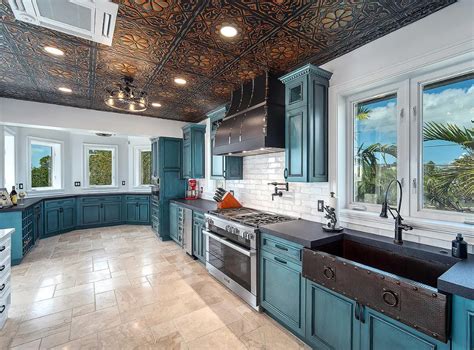 teal blue kitchen cabinets with stainlees steel|rustic teal kitchen cabinets.